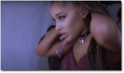 Ariana putting on a choker with a silver heart-shaped lock dangling in front excuse me, i love you (10 Dec 2020)